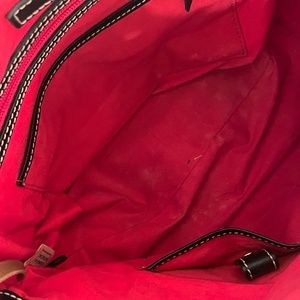 Dooney and Bourke Black and white initialed satchel.